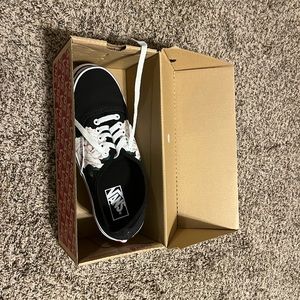 Black vans with floral details